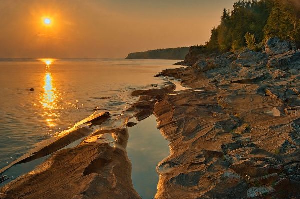 Canada-Ontario-Bruce Peninsula National Park Sunset on limestone rock